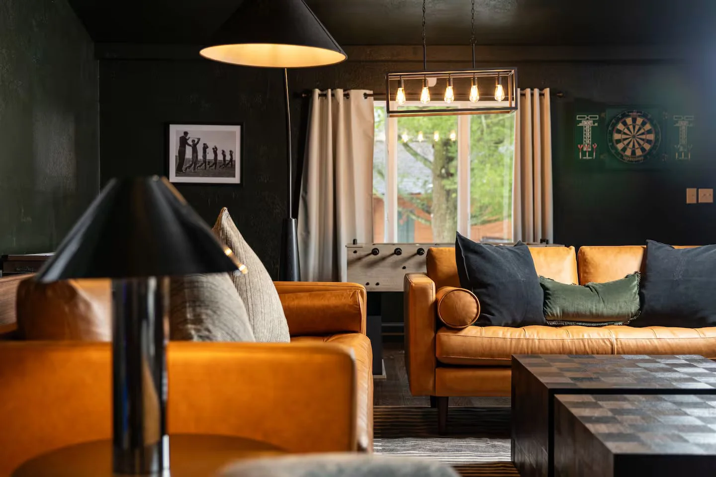 The living room is packed with style, yet functional for all with plenty of seating. Warm and inviting yet sleek and classy, it’s the perfect spot to relax, whether you’re watching a football game or reminiscing around a fire with friends + family!
