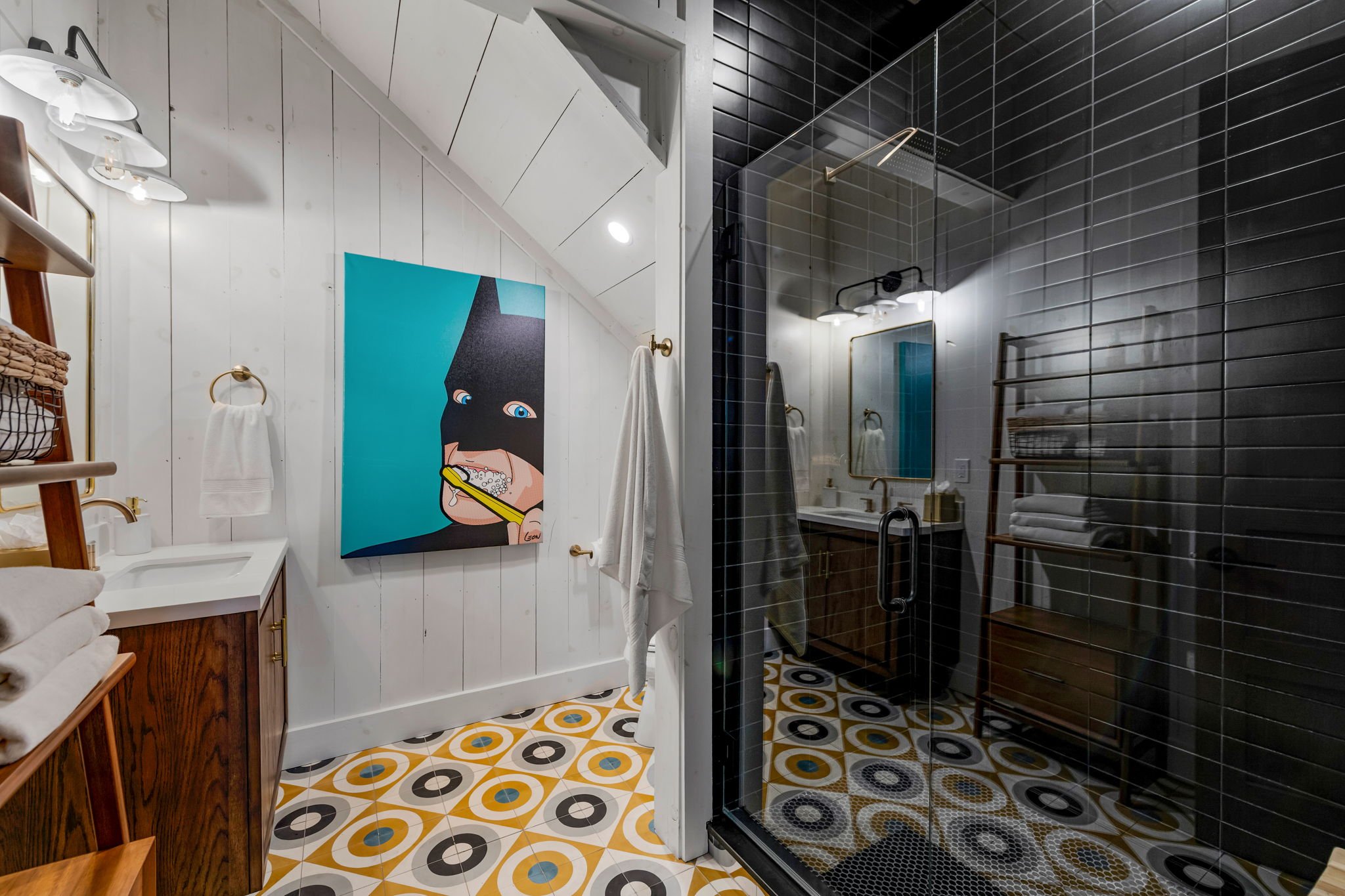 Refresh in this stylish bathroom featuring a spacious glass walk-in shower, modern tile, designer fixtures, and elegant vanity. Thoughtfully designed w/ upscale finishes, it offers a refined space to unwind after a day of mountain & lake adventures.