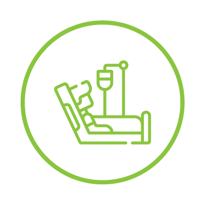 Hospital bed with an IV drip inside a green circle.