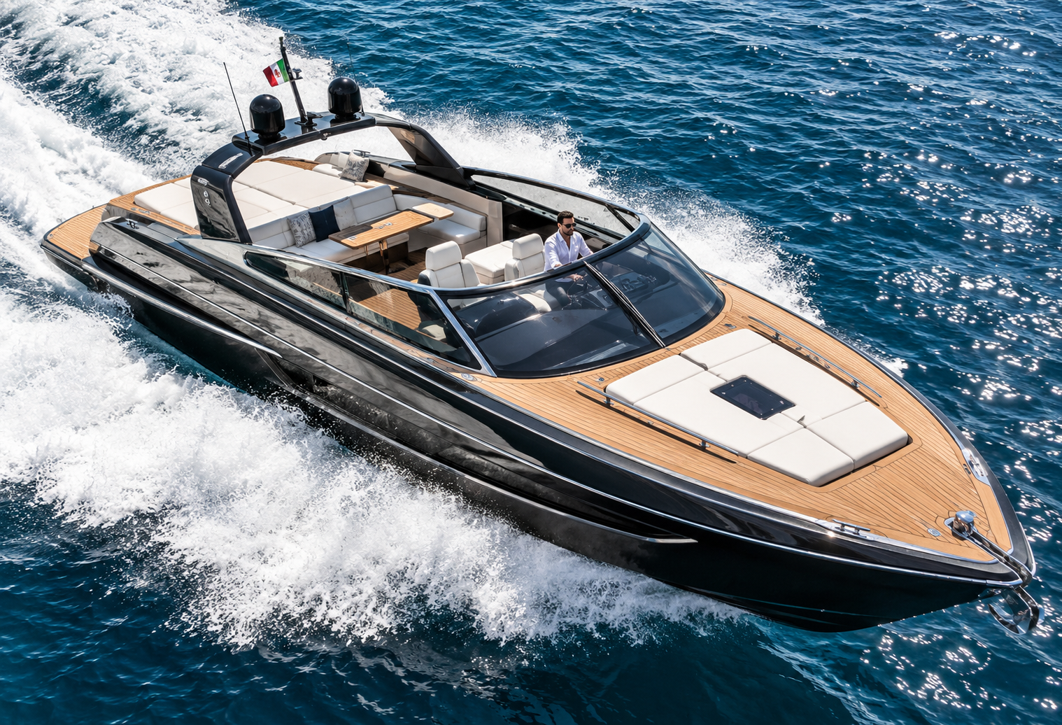 Luxury private yacht cruising through the Mediterranean Sea, featuring an elegant black hull, teak deck and exclusive VIP travel experience.