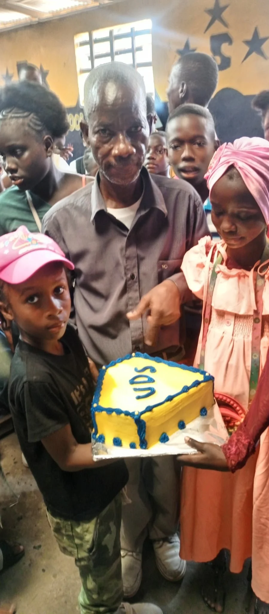 Cake Rally 4 03-07-25 Pastor Toe with Students.jpeg