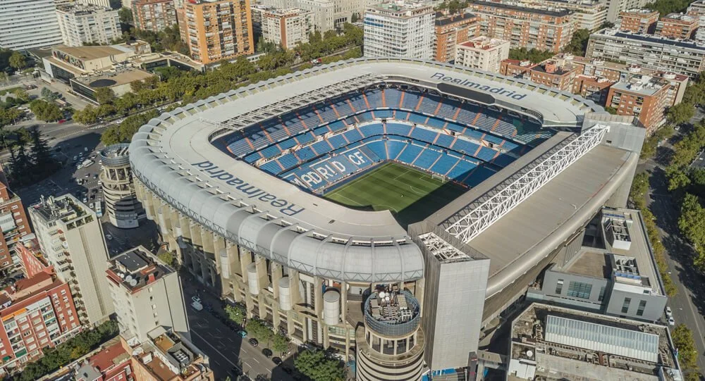 Overhead perspective of Real Madrid stadium, highlighting the empty pitch.