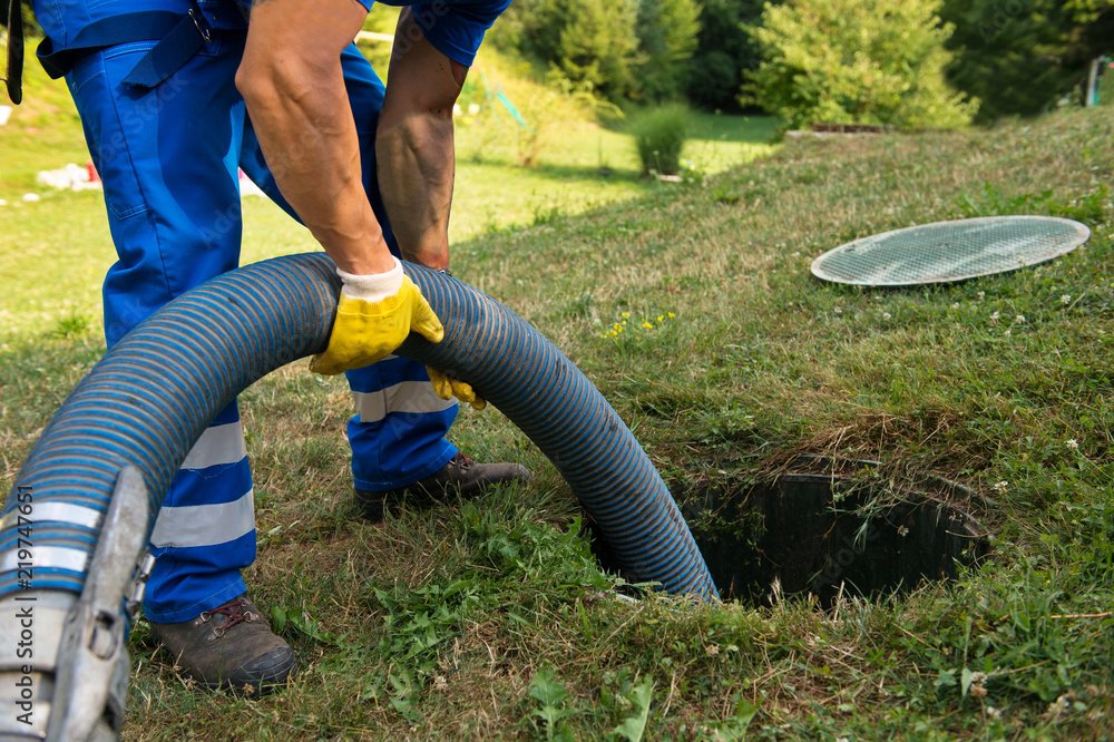 Pumping a septic tank to maintain and ensure its longevity.