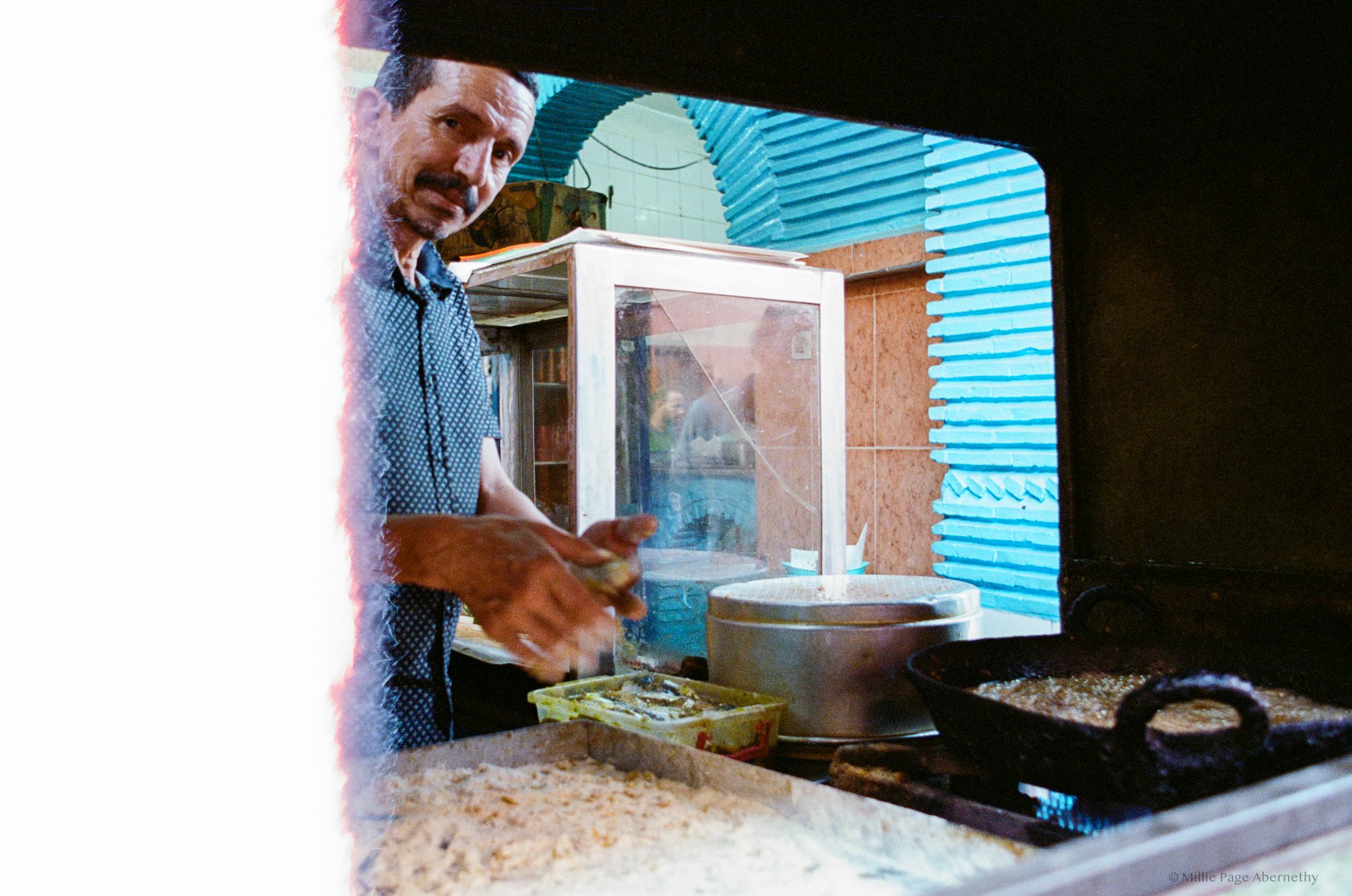 Hout Quari - The best Fish sandwich I've ever had. It consists of two sardines pressed together, coated in breadcrumbs, and then deep-fried in Ghee. The sandwich is served on a white bread roll with a tomato salsa with cilantro and chilli, raw onion,