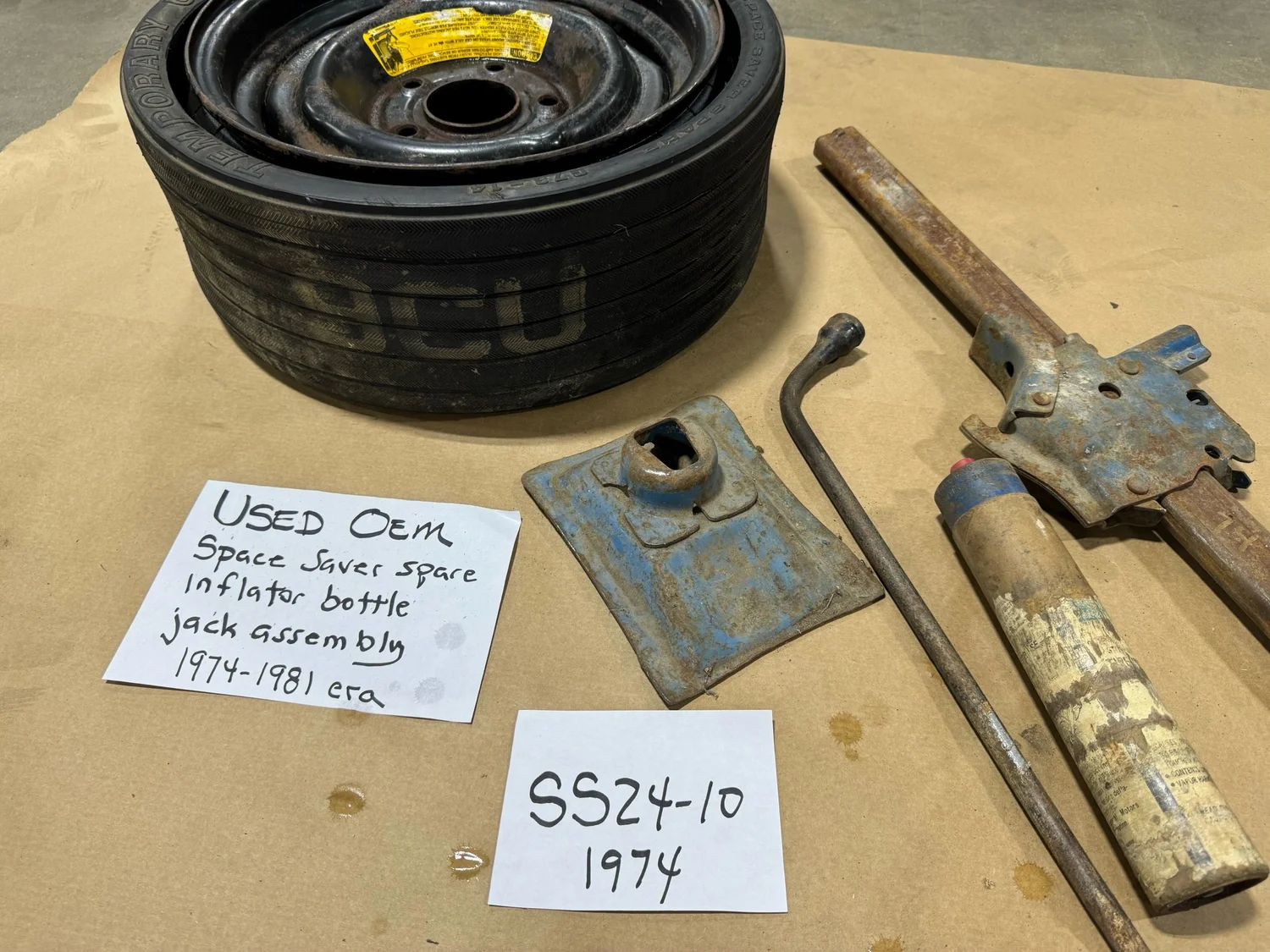 Space Saver spare tire, inflator bottle, jack assembly and