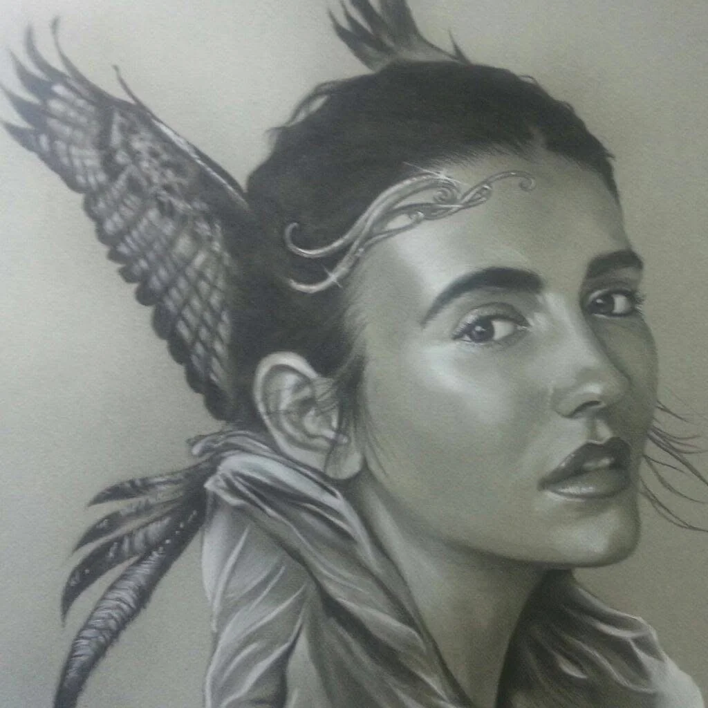 Charcoal portrait of a winged woman