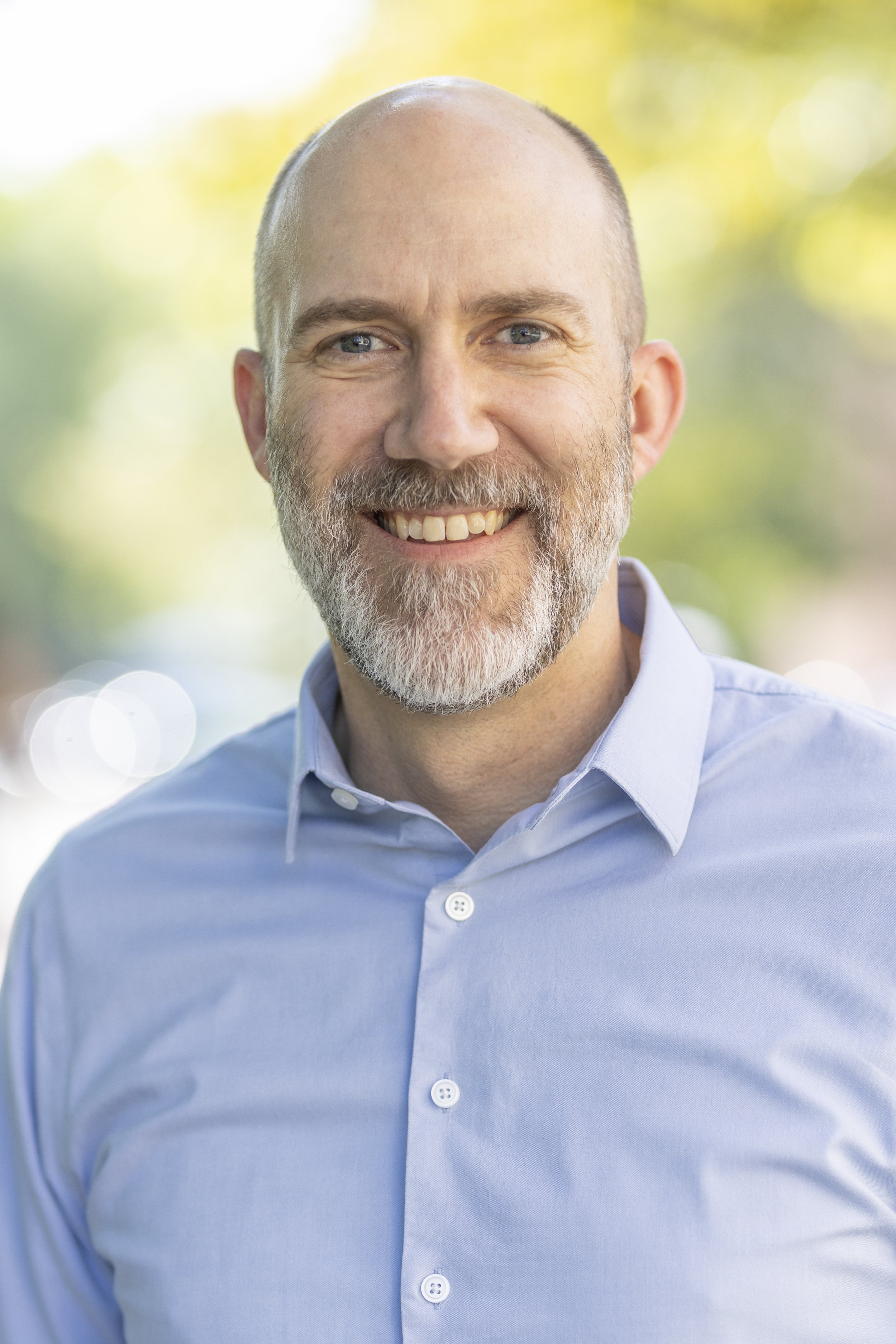 Portrait of Dr. Benjamin Peters, Director of the Global Scholars Program at the University of Michigan, specializing in political science and peace studies, with over 20 years of teaching experience and a focus on global education and peacebuilding.
