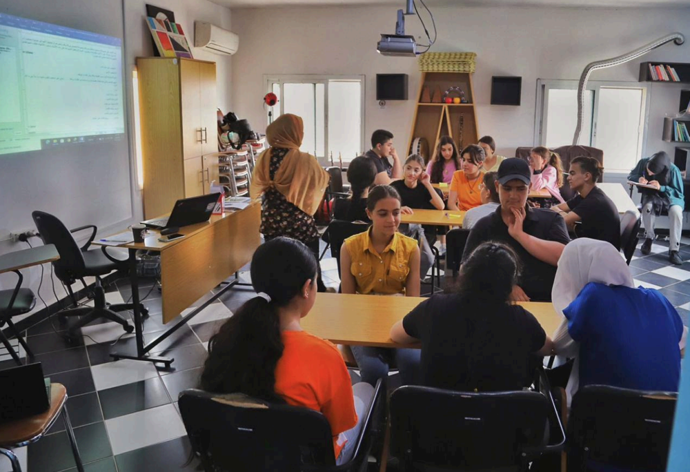 Young participants taking part in a Peace of Art dialogue session