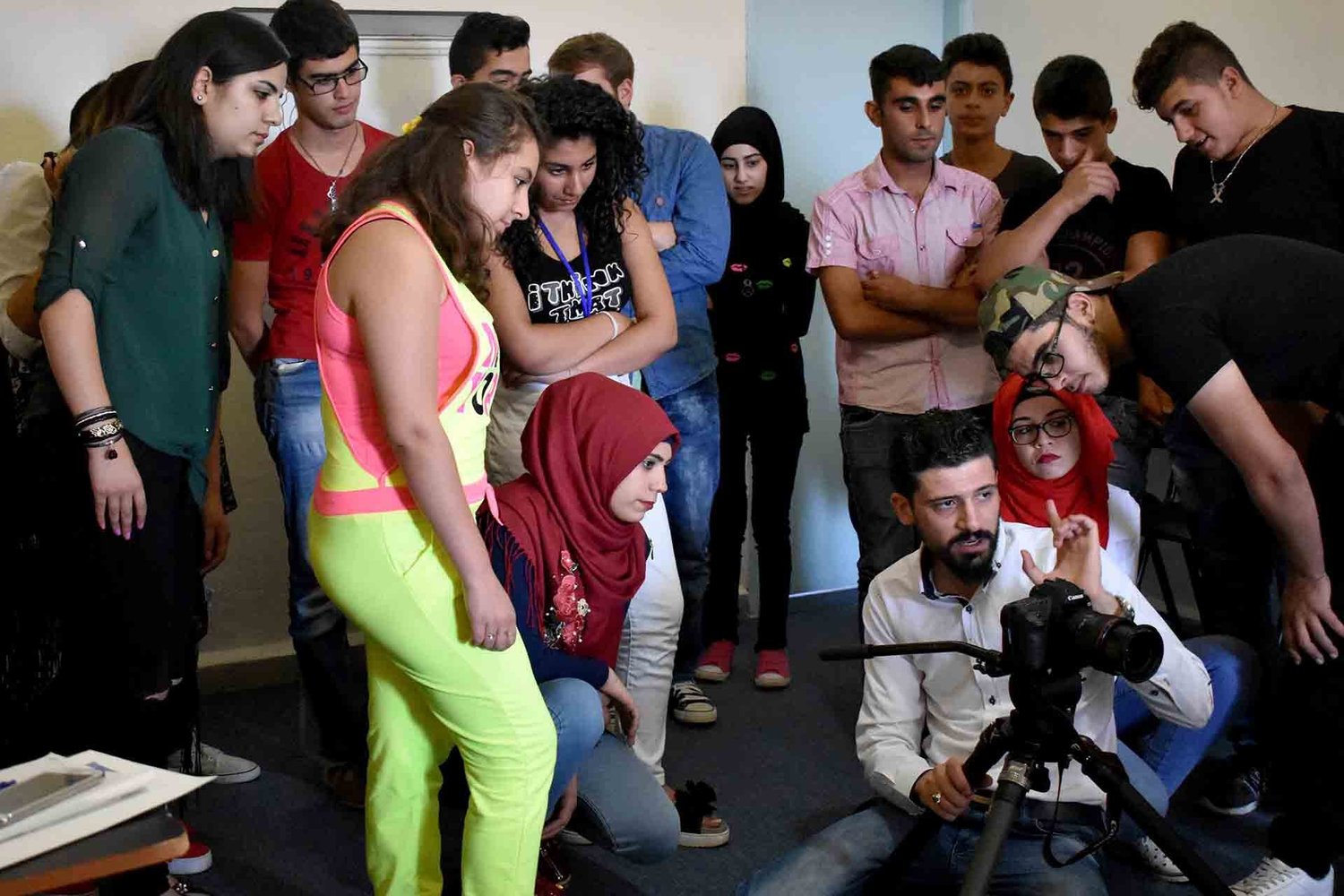 Youth participating in Art Against Discrimination photography training