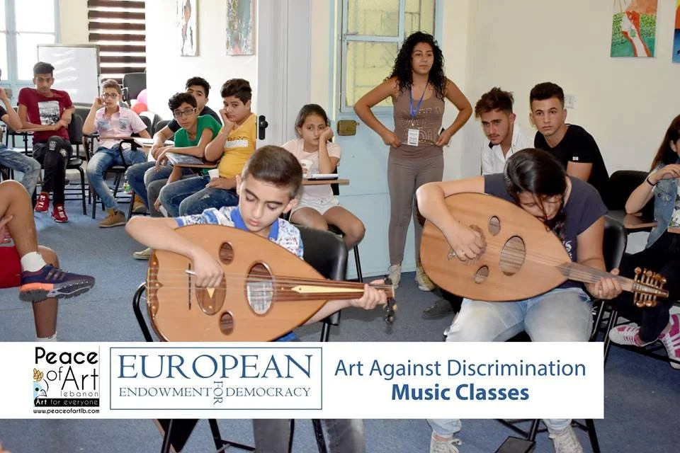 Young people learning music through Peace of Art's Art Against Discrimination program