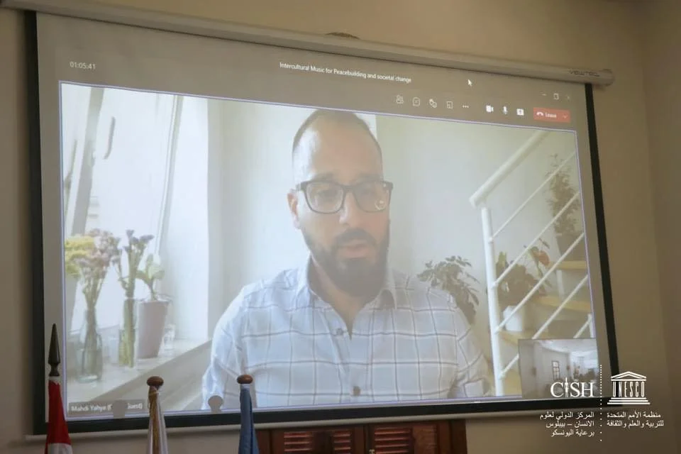 Mahdi Yahya addressing intercultural music peacebuilding roundtable
