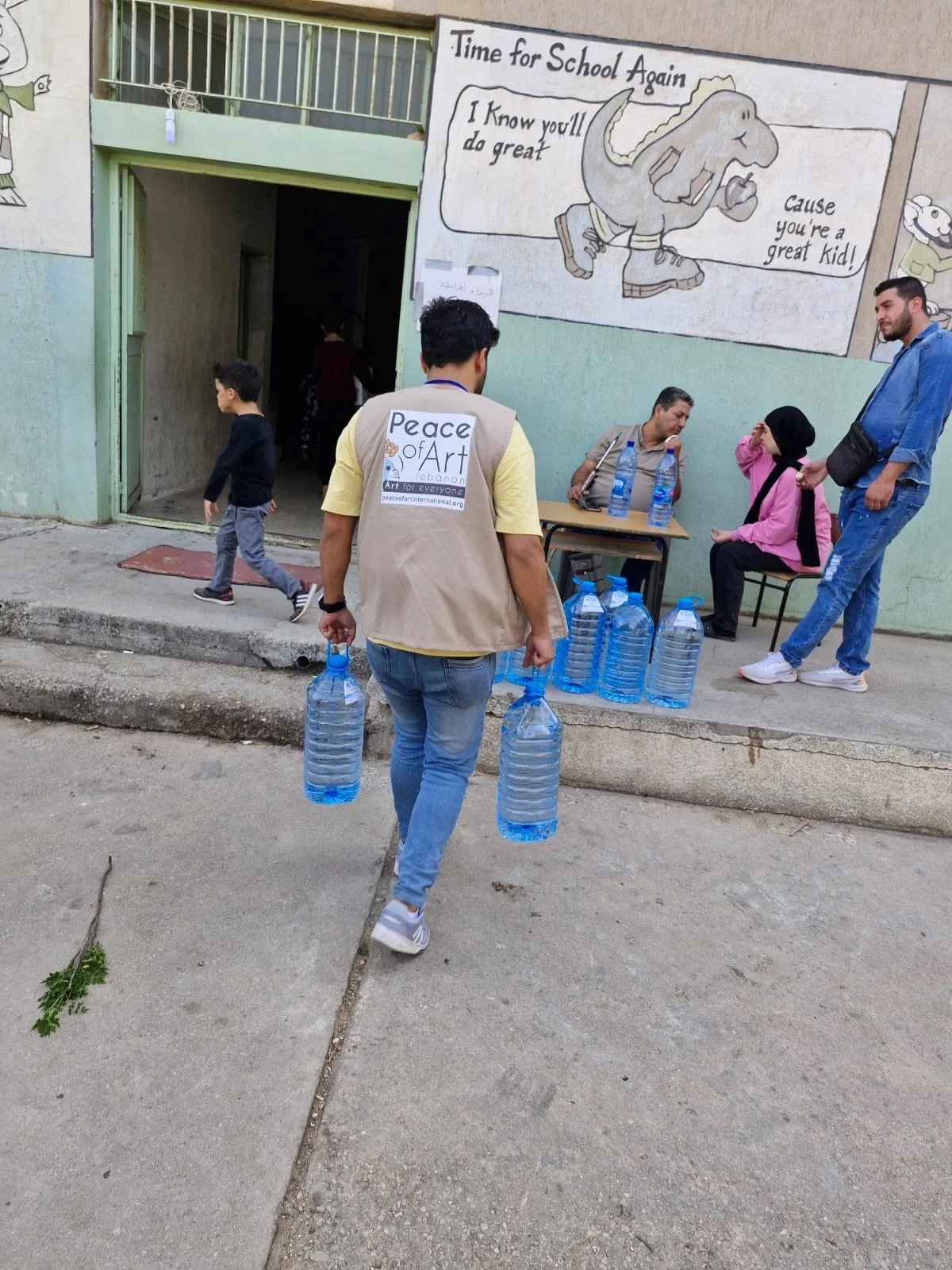 Peace of Art volunteer delivering drinking water during 2024 war response