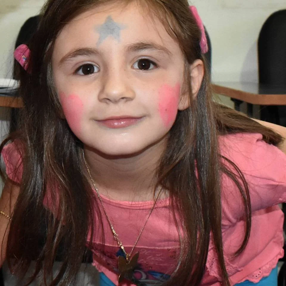 Young girl participating in music activity