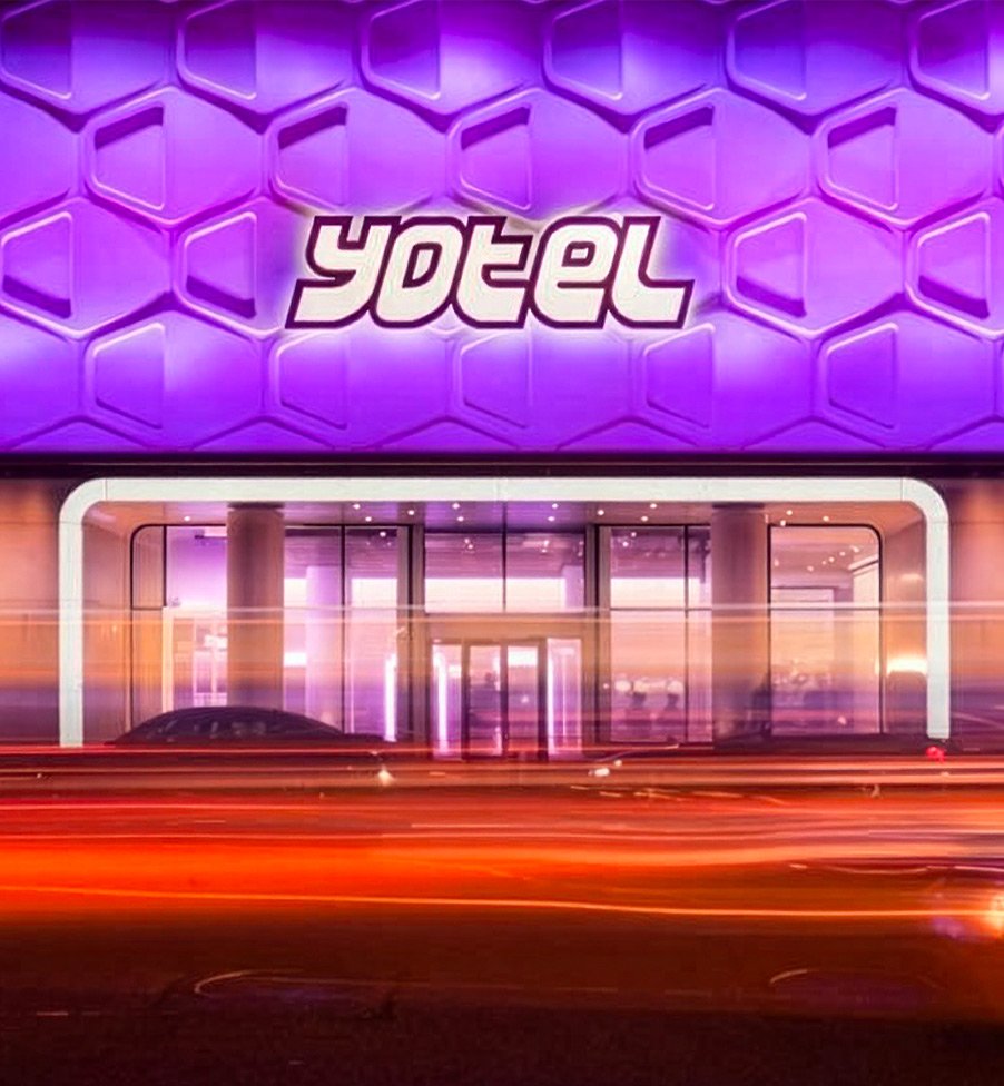 Exterior of YOTEL, showcasing the hotel's contemporary brand identity.