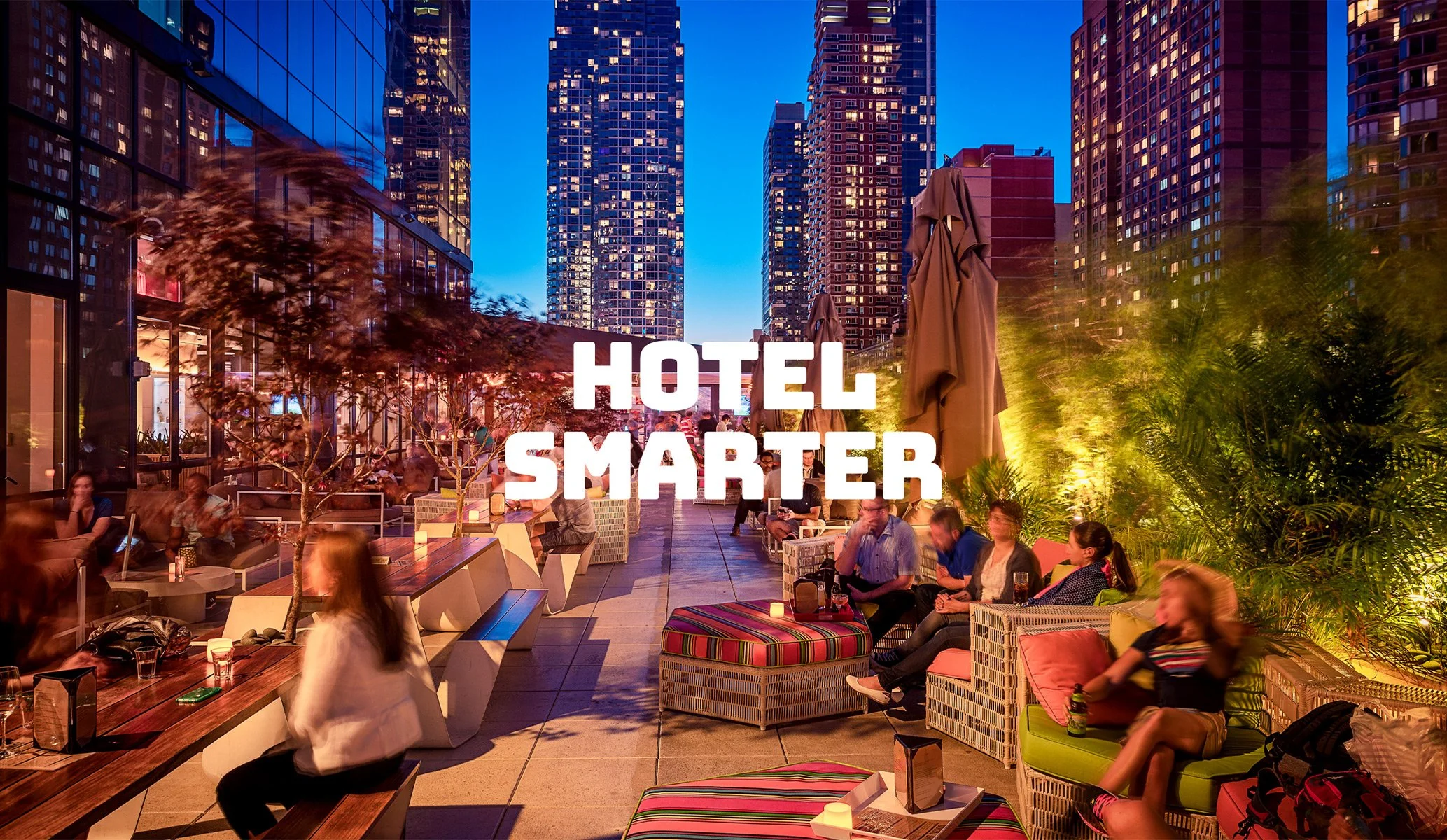 Balcony bar exterior in New York at Yotel with 'Hotel Smarter' centrally, the hotel strapline created by Colt as part of the brand identity
