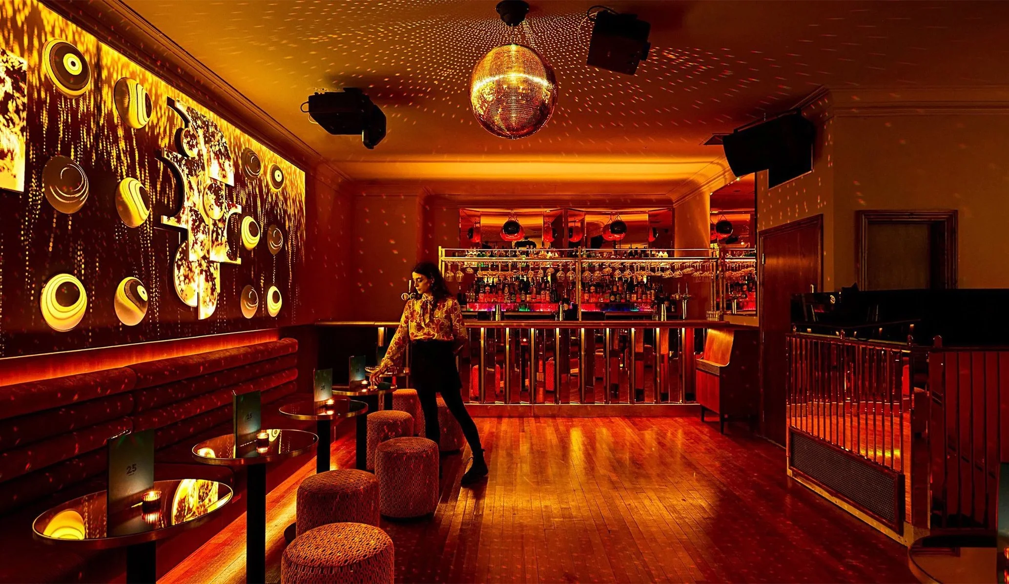 bar scene at night with a disco ball and intimate lighting