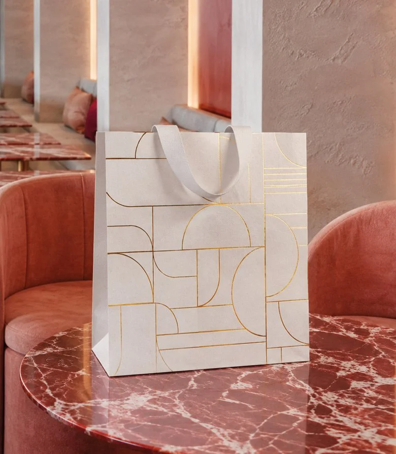 Luxury white paper back with large golf foil blocked pattern