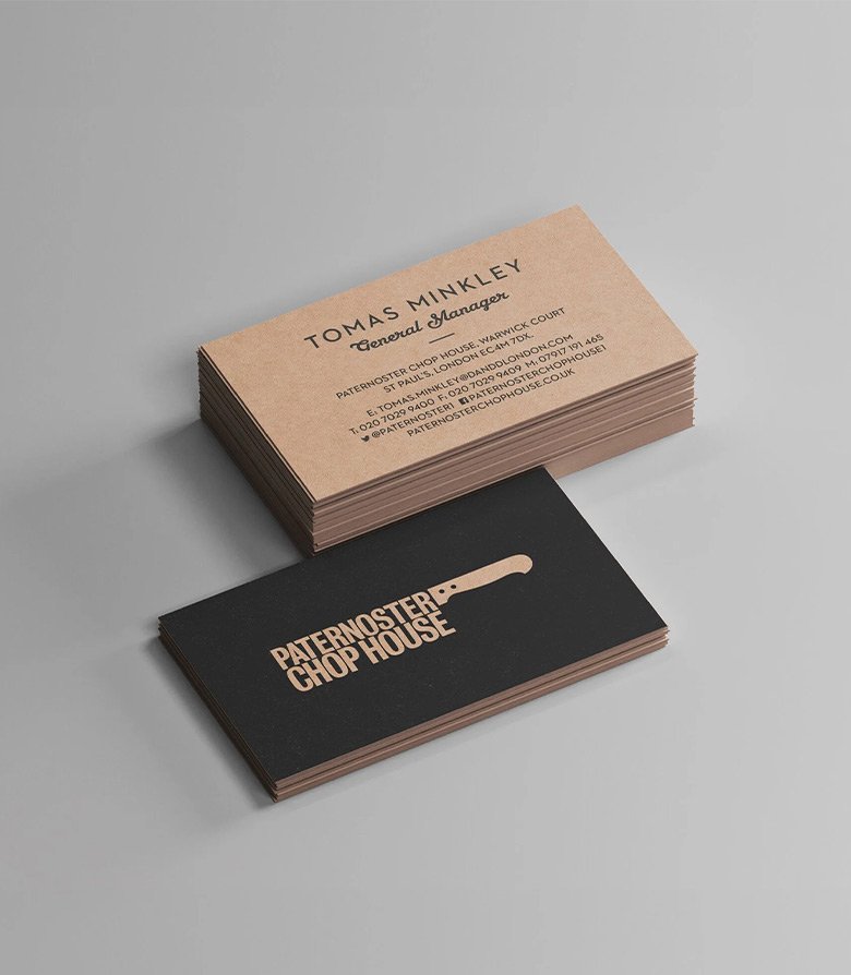 Stack of business cards printed on greyboard featuring the Paternoster Chop House Logo