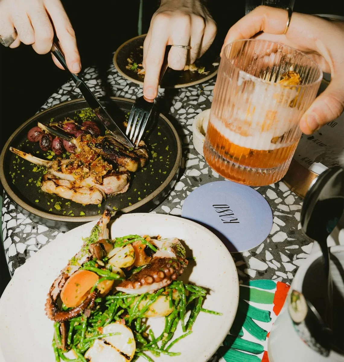 Restaurant dining experience with contemporary dishes and cocktails for Kaso restaurant hospitality branding.