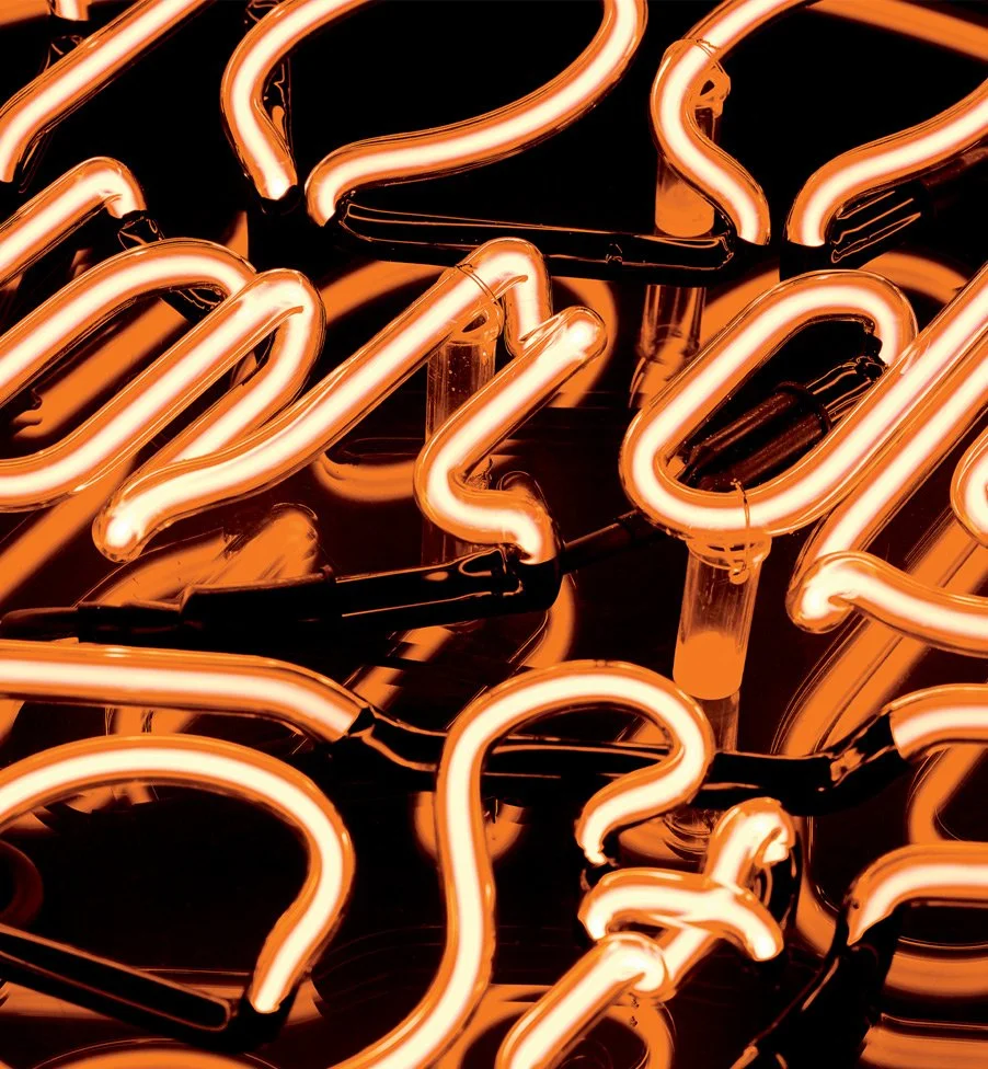 Close-up photograph of custom neon signage created as a signature brand asset for 100 Wardour St.