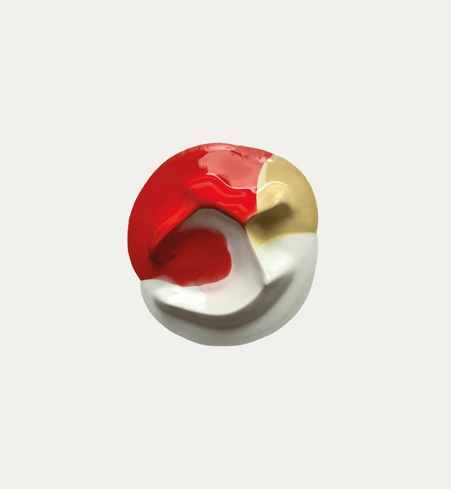 a blob of red, gold and white paint on a light background