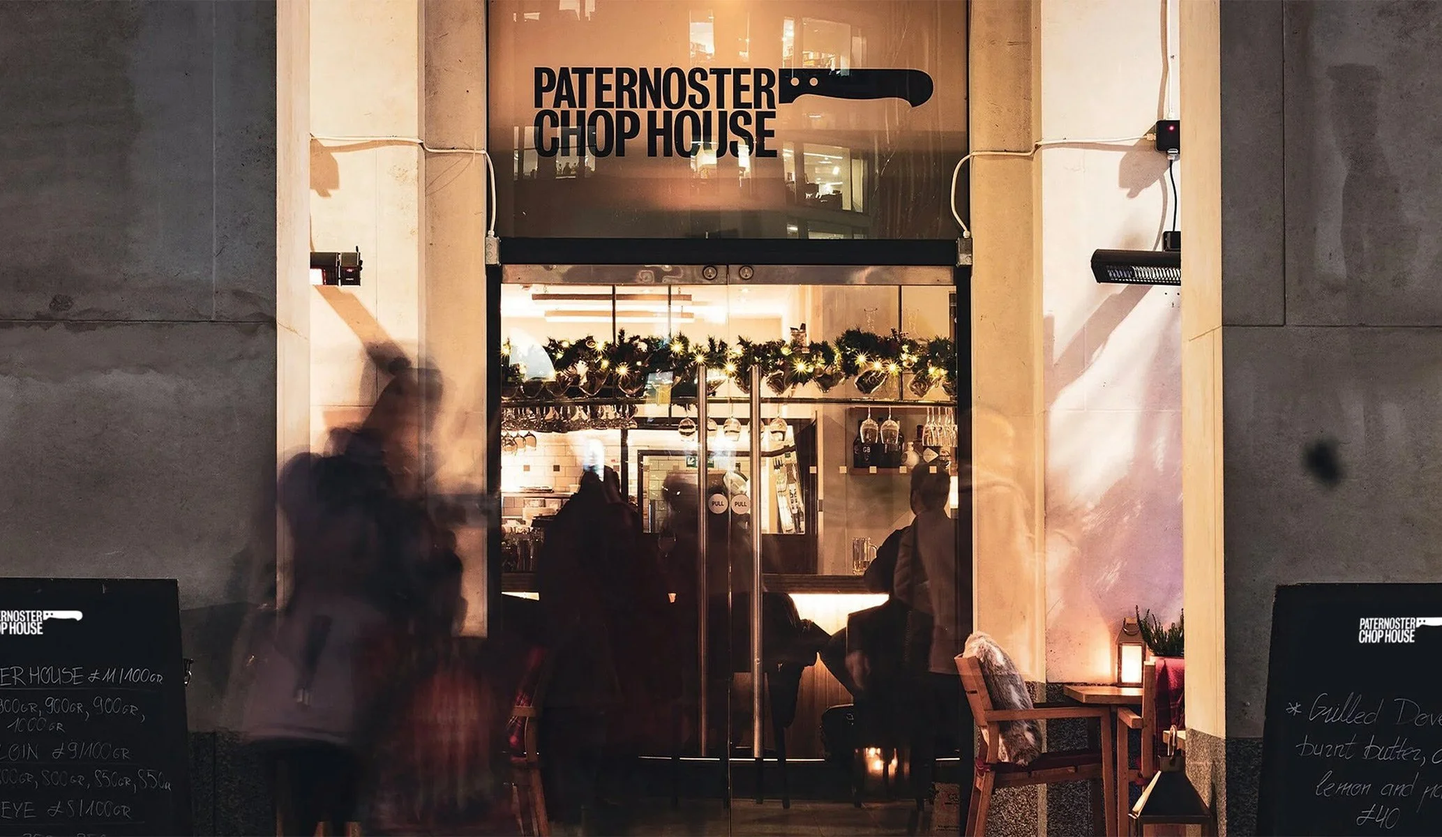 Entrance to Paternoster Chop House restaurant featuring the cleaver logo designed by Colt