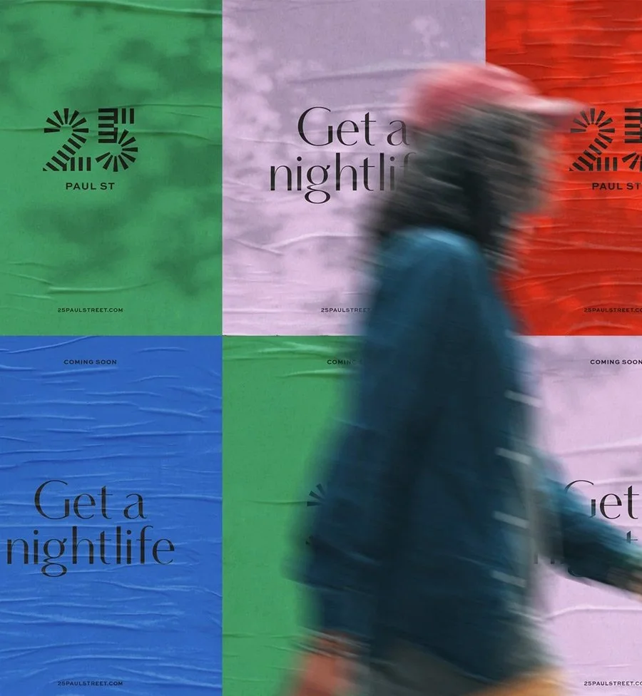 Promotional posters for 25 Paul Street displayed on a London street.