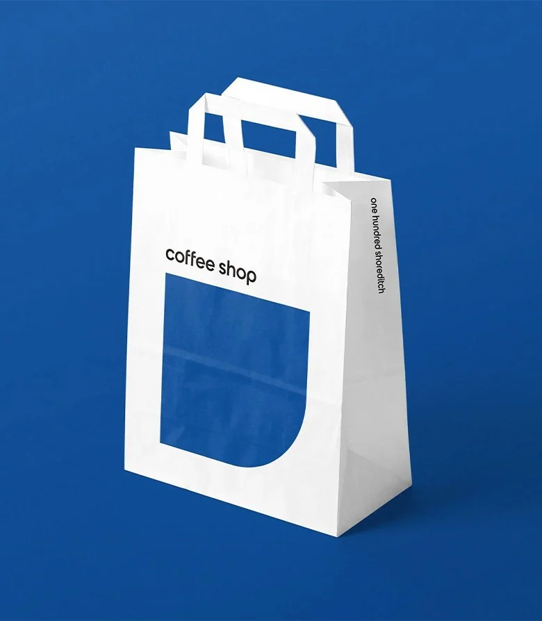paper takeaway bag for One Hundred Shoreditch coffee shop created as part of the suite of collateral when applying the new brand identity by Colt