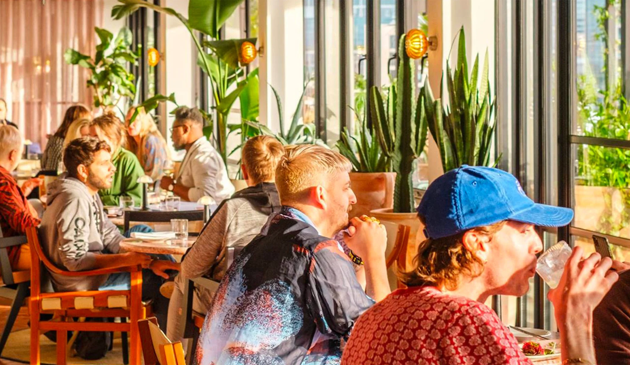 guests at Kaso bar, the rooftop bar at 100 shoreditch hotel