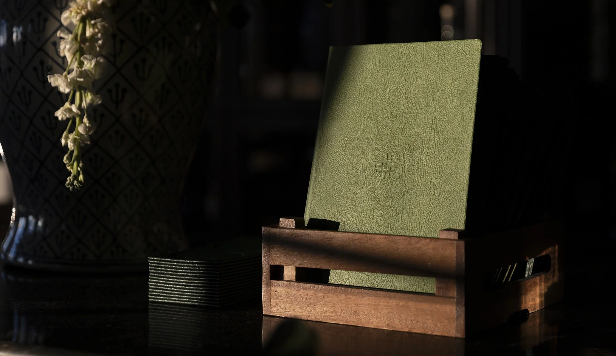 green leather restaurant menu produced as part of the brand identity for Dunluce Lodge designed by Colt branding agency, London
