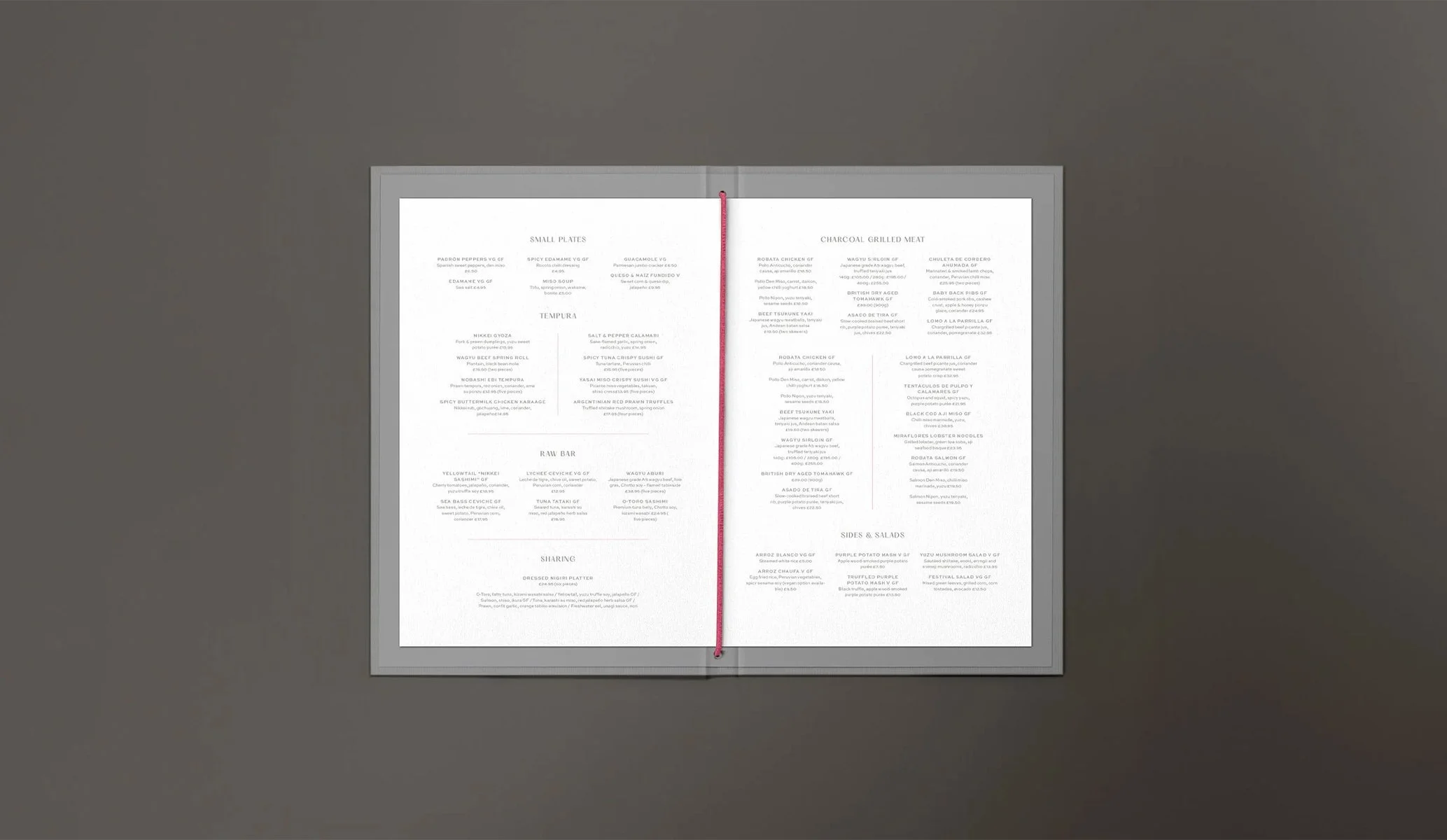 open grey menu folder with pink fabric bind, created by Colt as part of the brand identity for Contigo restaurant in London