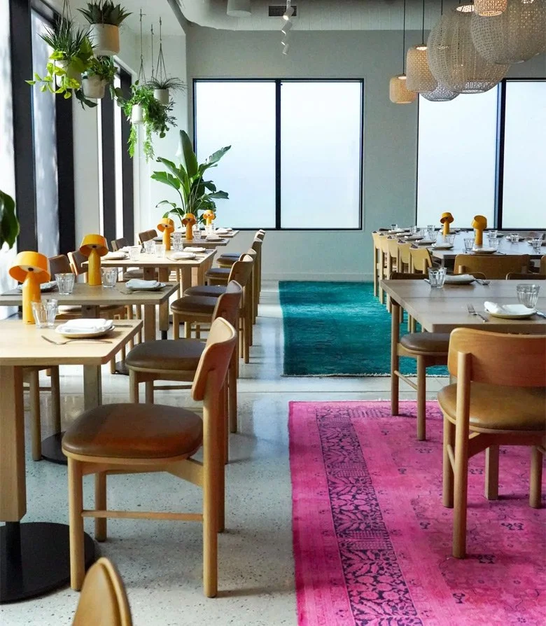 Interior design featuring tables, chairs and rugs at Douro, Maine