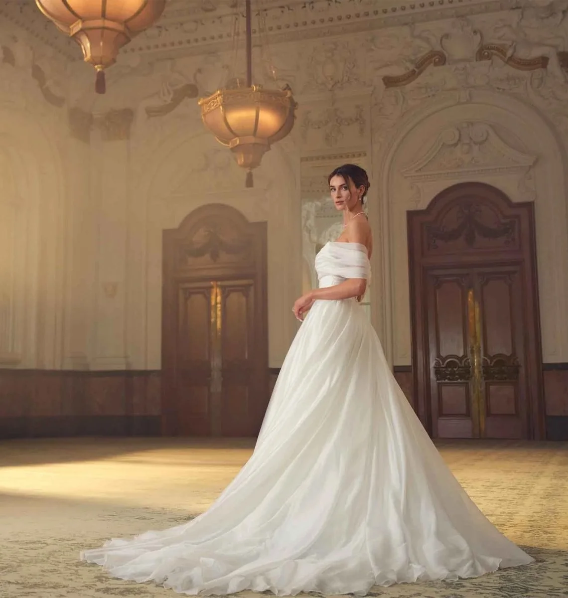 Bride in the historic ballroom at The Grand Birmingham showcasing luxury hotel branding and hospitality design.
