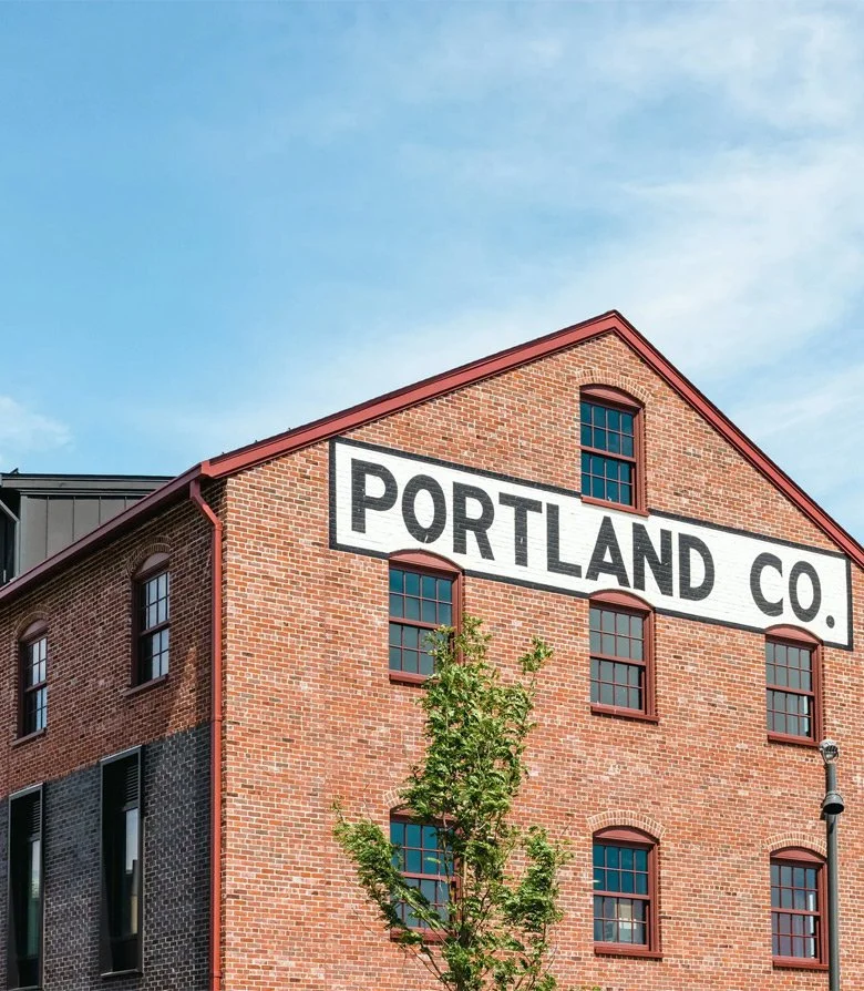 Exterior of Twelve restaurant featuring the original painted signage in Portland, Maine