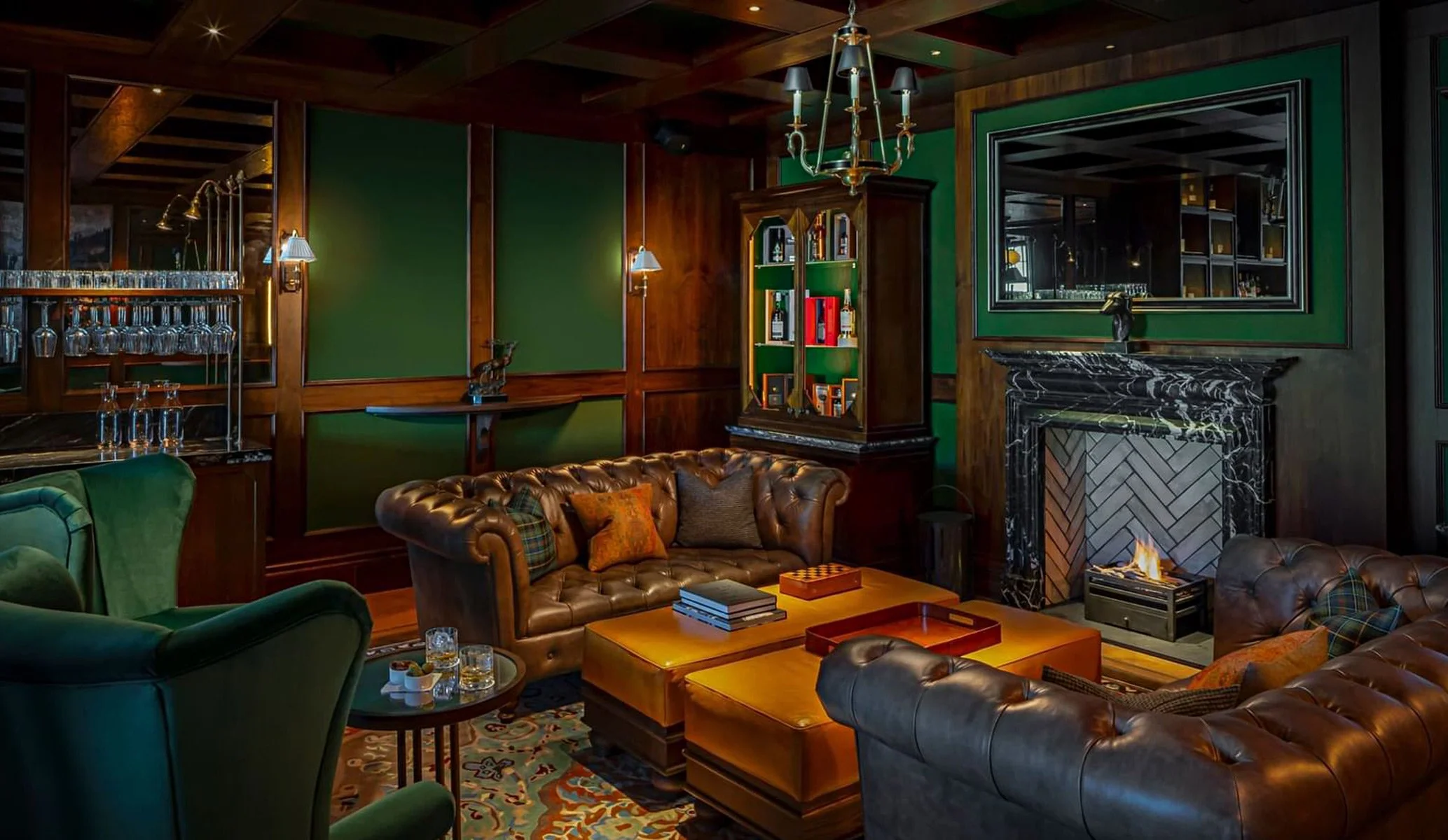 whiskey bar with green panelled walls and brown sofas at Seaton House hotel