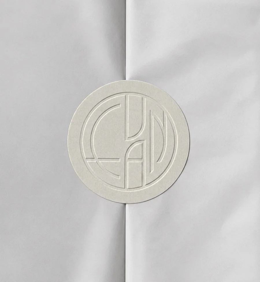 white paper sticker with blind embossed Evan Bakery logo