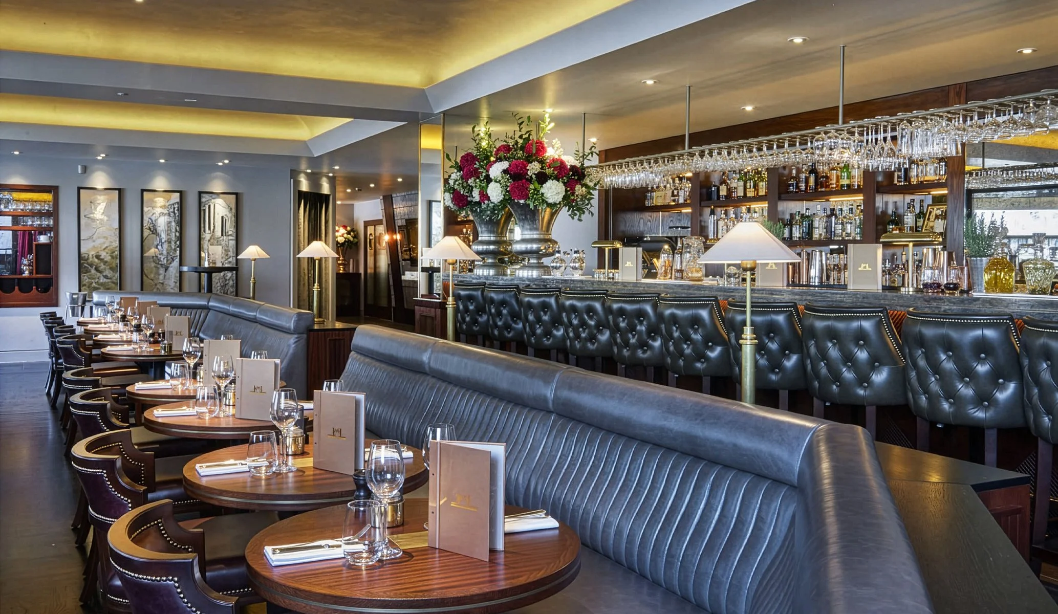 the bar at Pont De La Tour by Tower Bridge in London featuring branded menus on each table