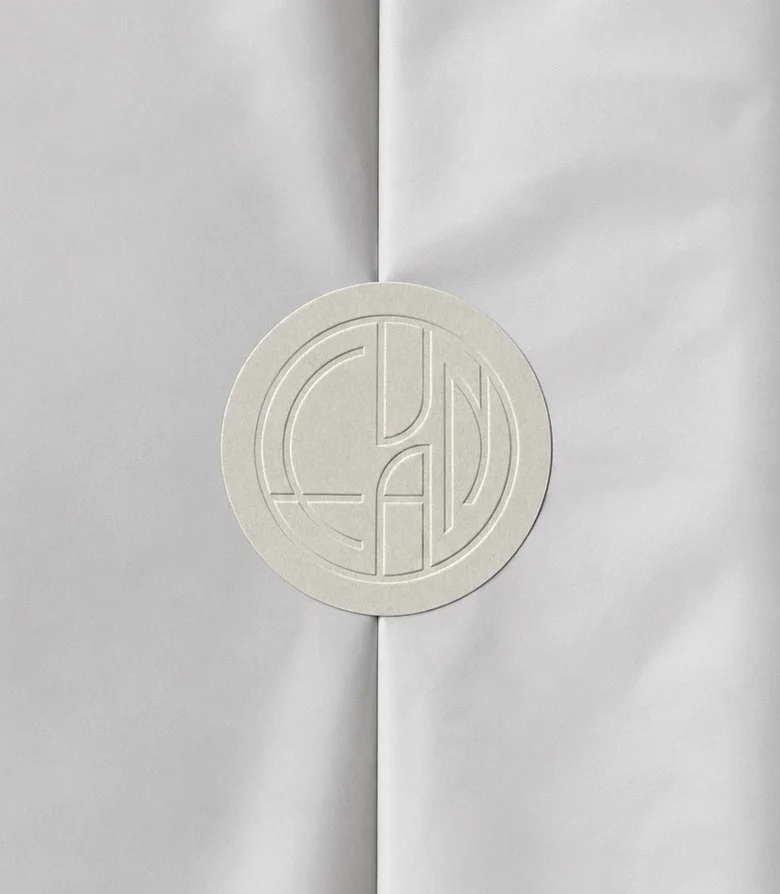 blind embossed paper sticker with the logo shorthand for Evan Bakery in Al Ain
