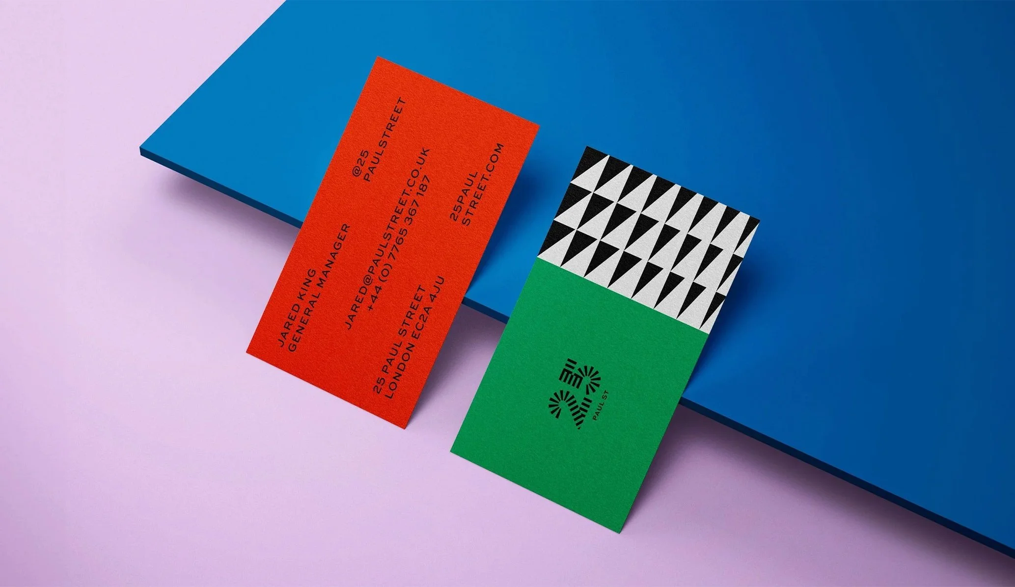 two brightly coloured business cards featuring the brand identity designed by Colt for 25 Paul St bar