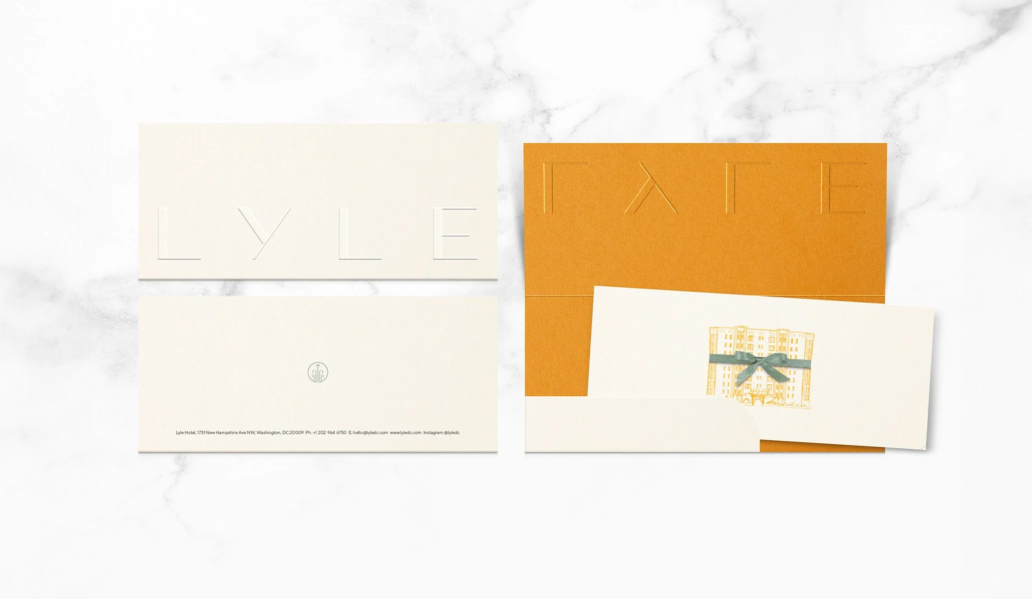 Gift voucher and sleeve featuring a blind embossed logo with an orange interior for Lyle Hotel in Washington designed by Colt