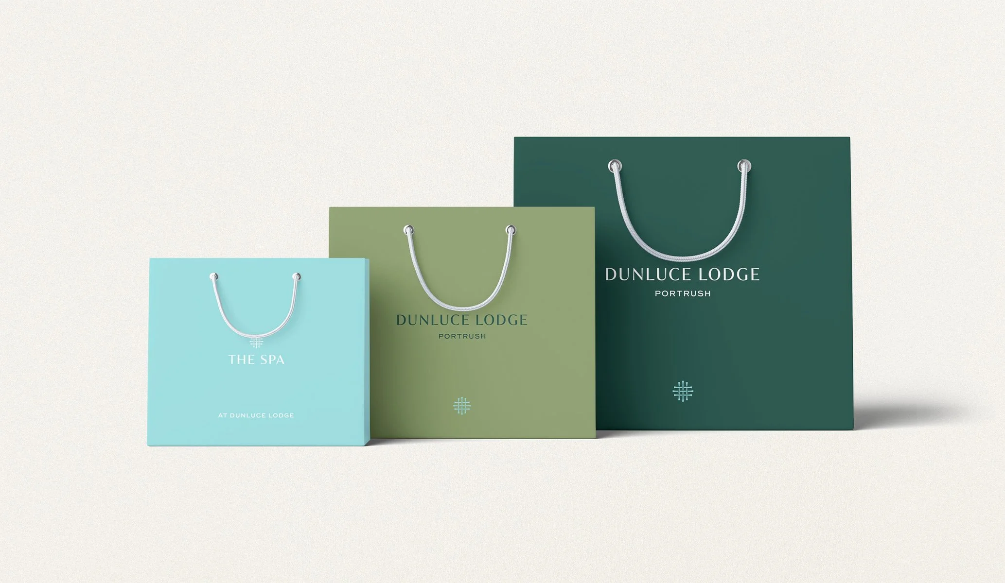 branded luxury paper bags produced as part of the brand identity for Dunluce Lodge designed by Colt branding agency, London