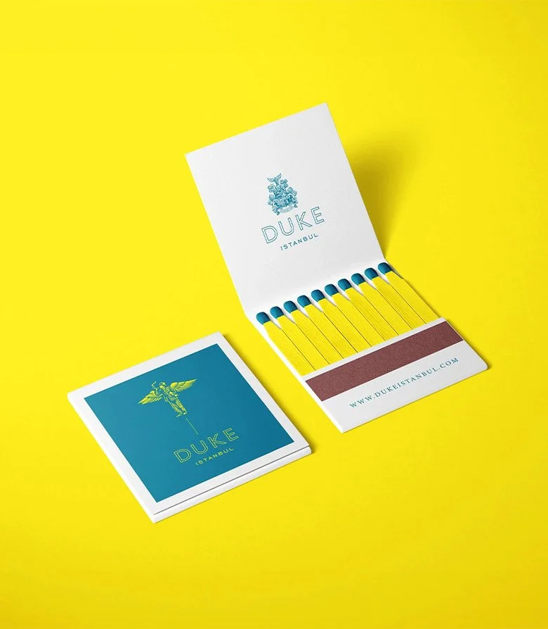 Matches on a yellow background for Duke restaurant in Istanbul, created as part of the brand identity by Colt