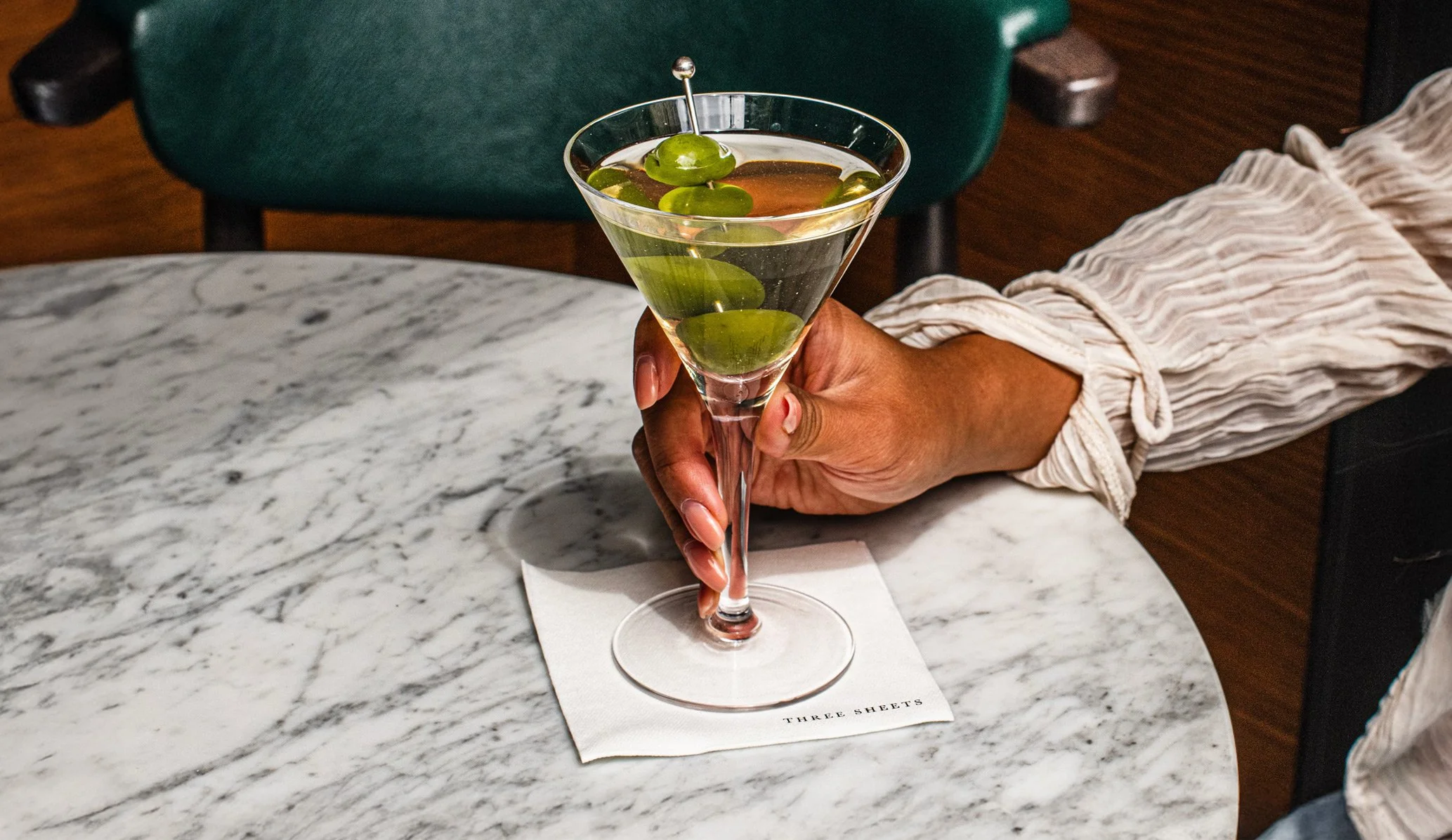 Cocktail and coaster for three sheets rebrand and new brand identity designed by Colt