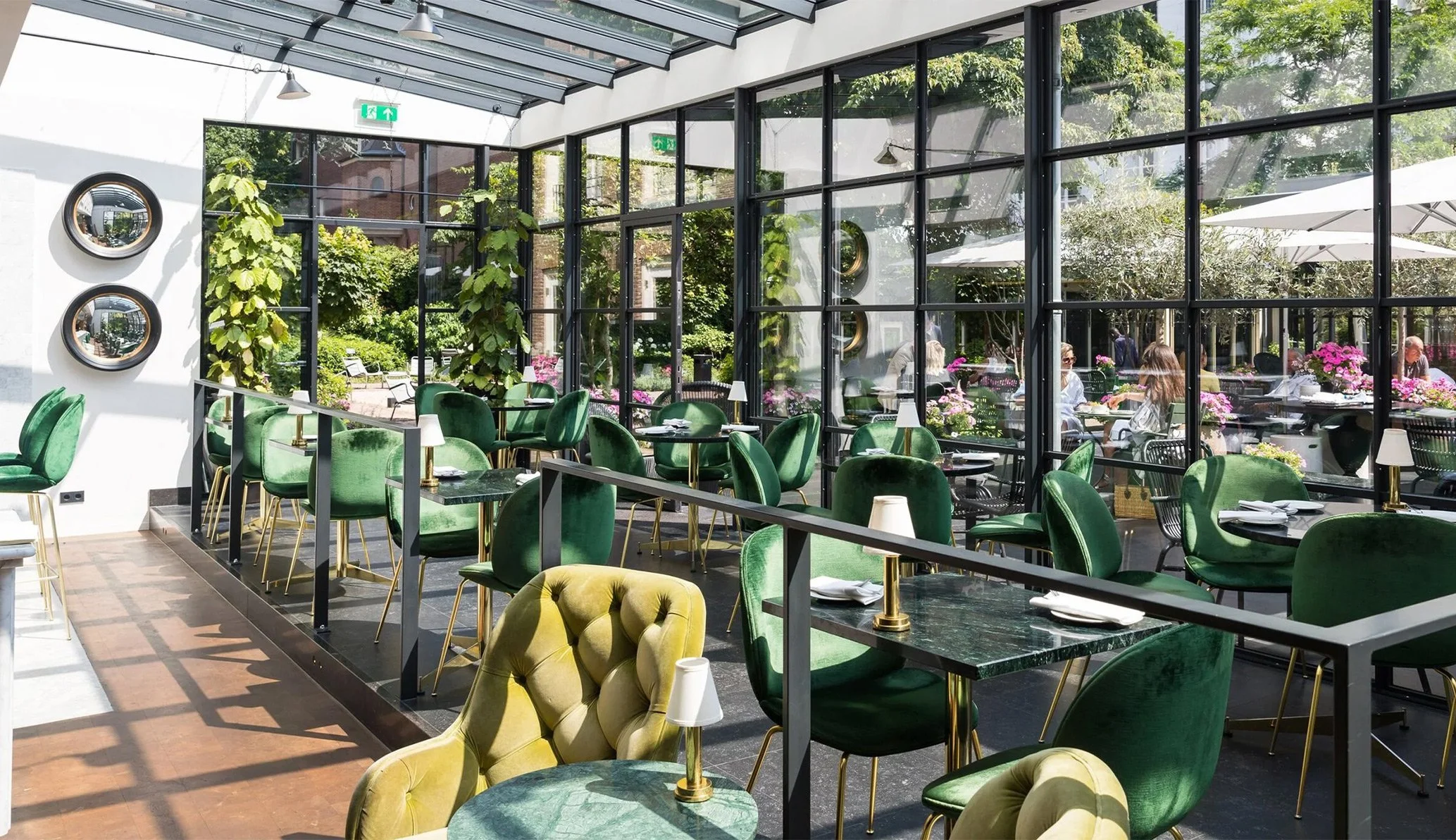 restaurant with green chairs at natural light at pulitzer garden, Amsterdam