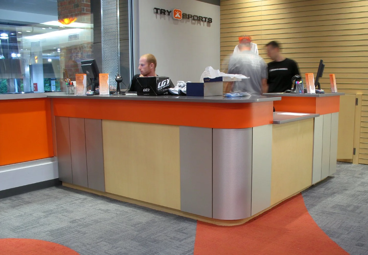 custom millwork transaction counter - 3 panels for three sports; run, bike, swim