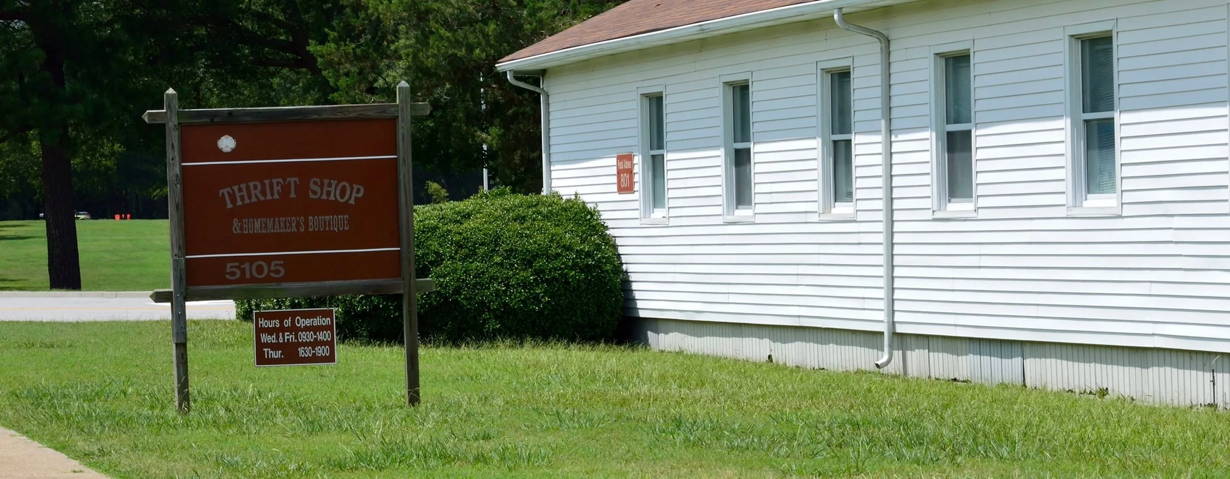 Exterior of the GASC Thrift Shop at building 5105, with the shop sign beside the building