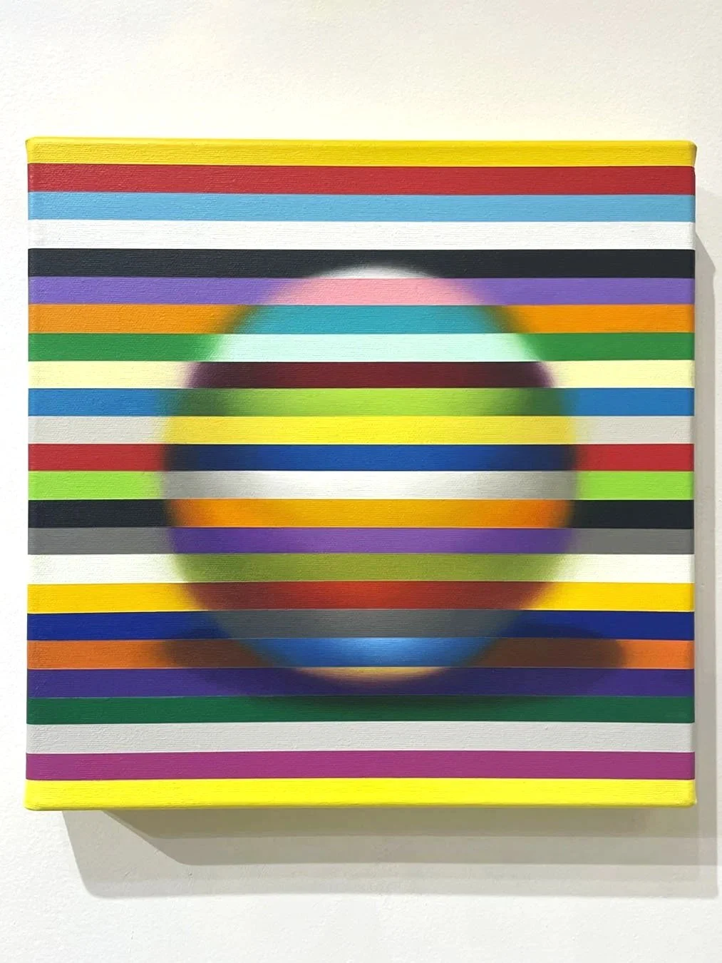 Abstract painting with multicoloured horizontal stripes forming a softly blended sphere in the center