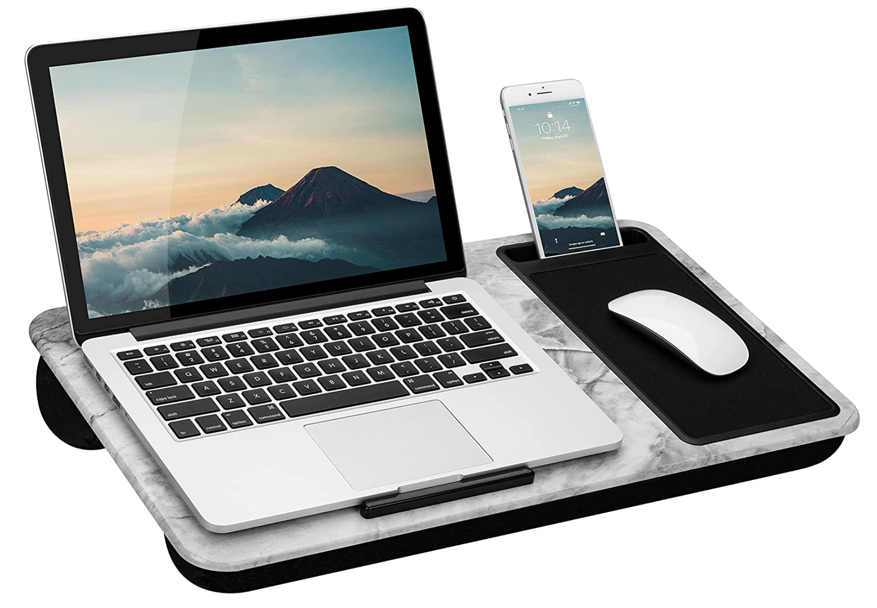 Laptop resting on marble patterned lap desk with iphone and mouse pad