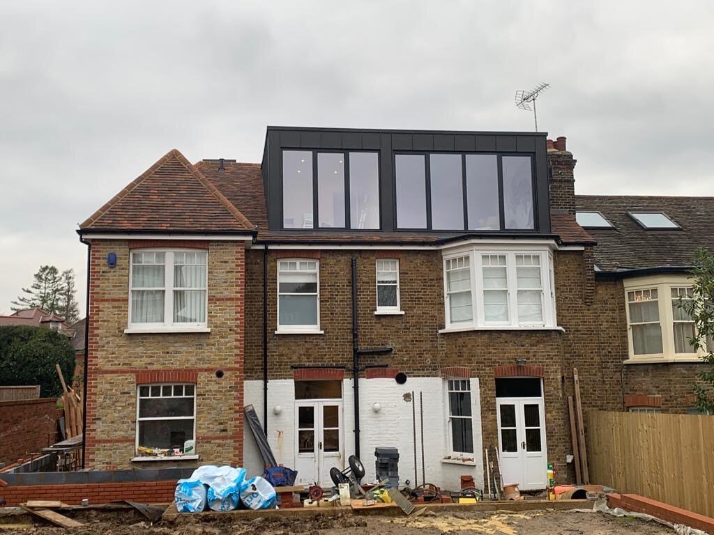 Under construction first phase completed, Zinc clad dormer with aluminium framed floor to ceiling windows. #essex #homerenovation #architecture #loughton