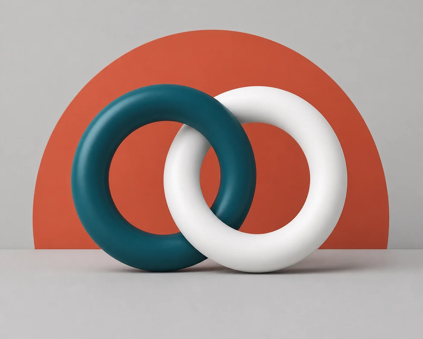 Two interlocking circular shapes in contrasting colors, symbolizing integration, connection, and system interoperability.